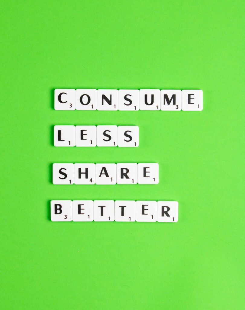 neon green background with scrabble pieces that say consume less share better